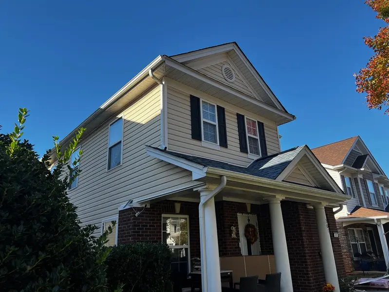 Cost Breakdown of a New Roof Installation in Charlotte Triumph Roofing contractors installing asphalt shingles on a Charlotte home
